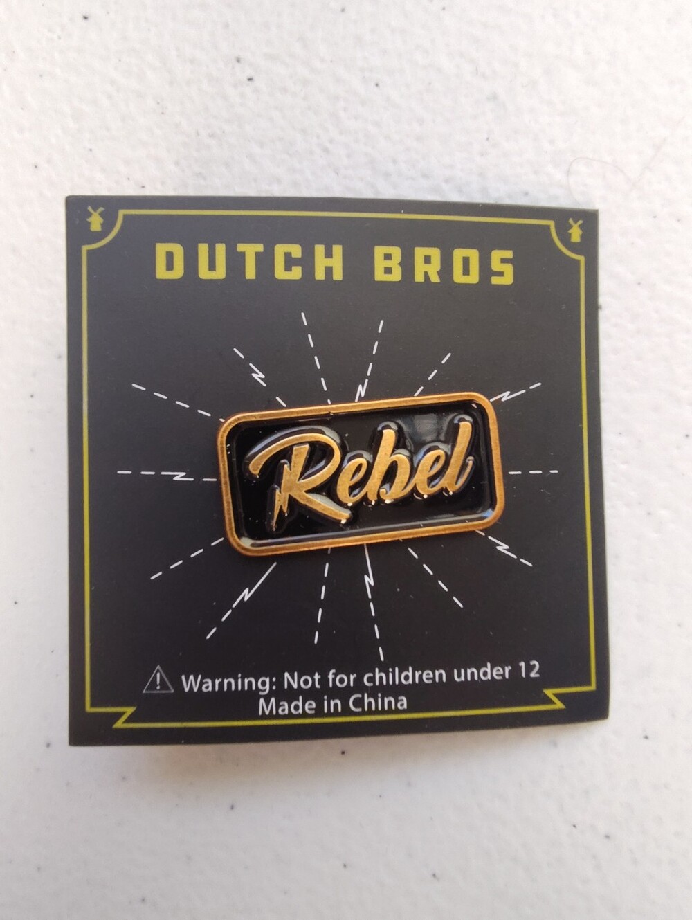 Dutch Bros Black and Gold Rebel Pin